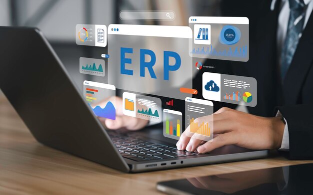 person working on a laptop with various digital graphs and data visualizations related to ERP