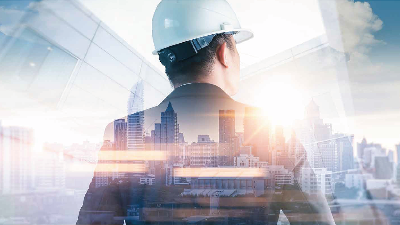 A professional engineer in a suit and hard hat, standing with his back to a city skyline, symbolizing leadership and construction.